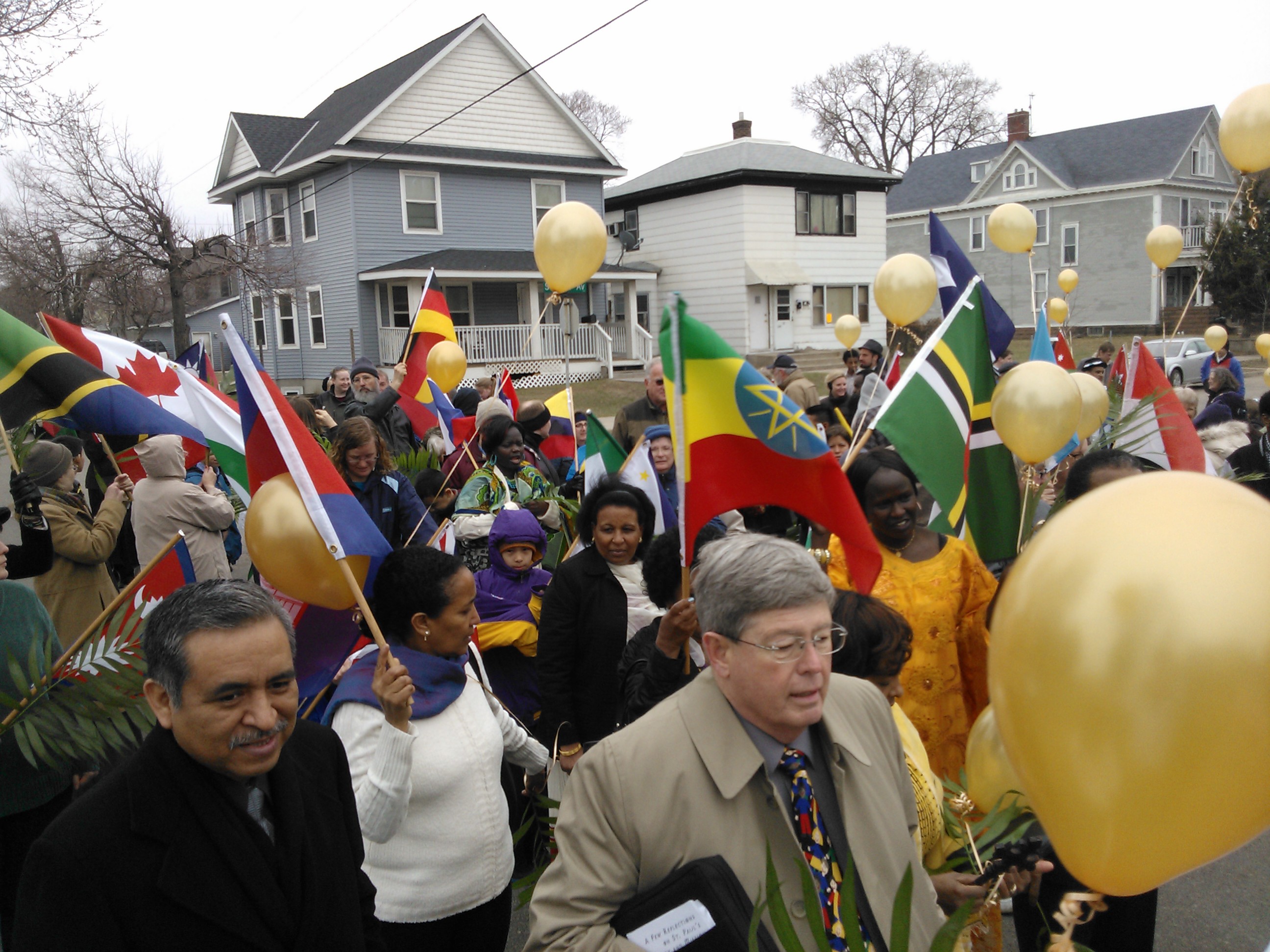 Reverend Roland Wells (Center) helps to lead the colorful march.