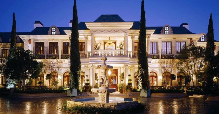 A gorgeous luxury Atlanta mansion at night.