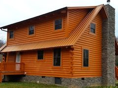 Large two story North Georgia cabin with deck and stone fireplace listed for sale.