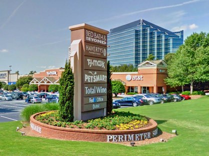 A popular Dunwoody shopping center with office buildings in the distance.