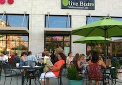 Guests enjoying outdoor dining at Olive Bistro Mediterranean Cafe.