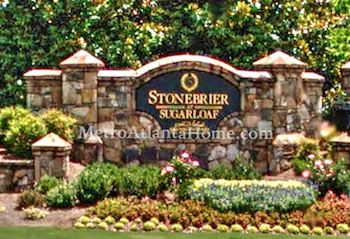 The stone neighborhood sign at the entrance to Stonebrier At Sugarloaf.