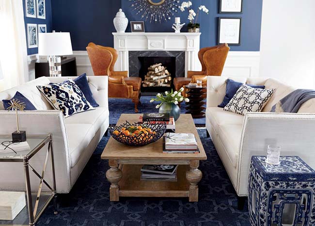 Blue living room with various couches and chairs - Coldwell Banker Paradise