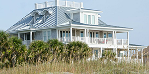Blue house on the beach - Coldwell Banker Paradise