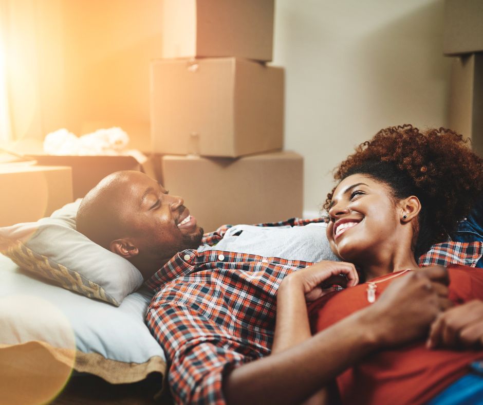 Couple getting into new home from renting